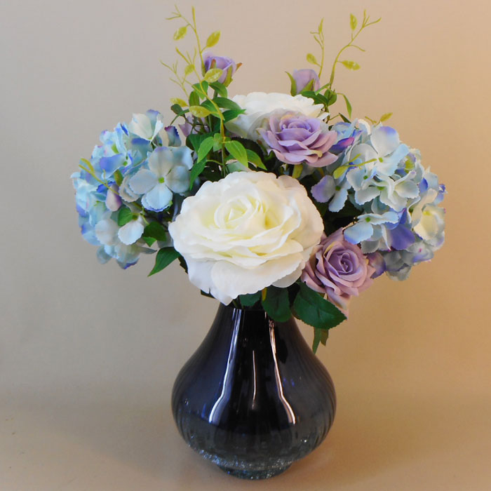 Blue artificial deals flowers in vase